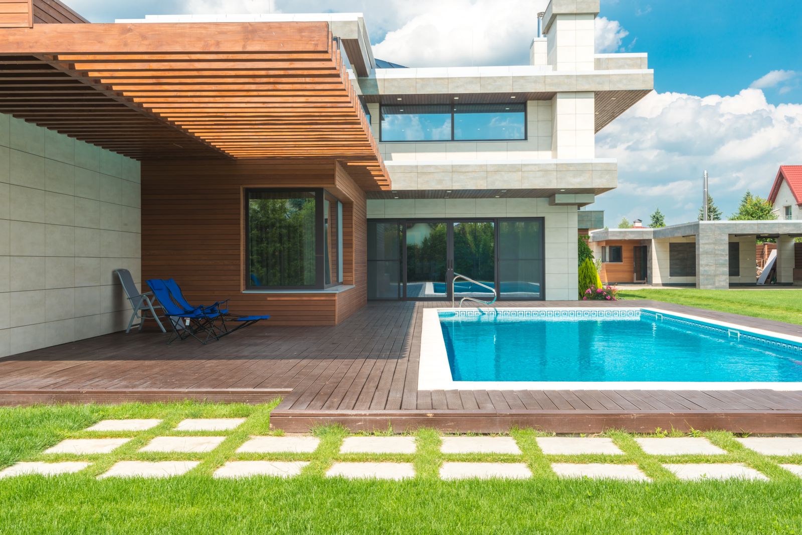 Villa exterior with pool deck after renovation